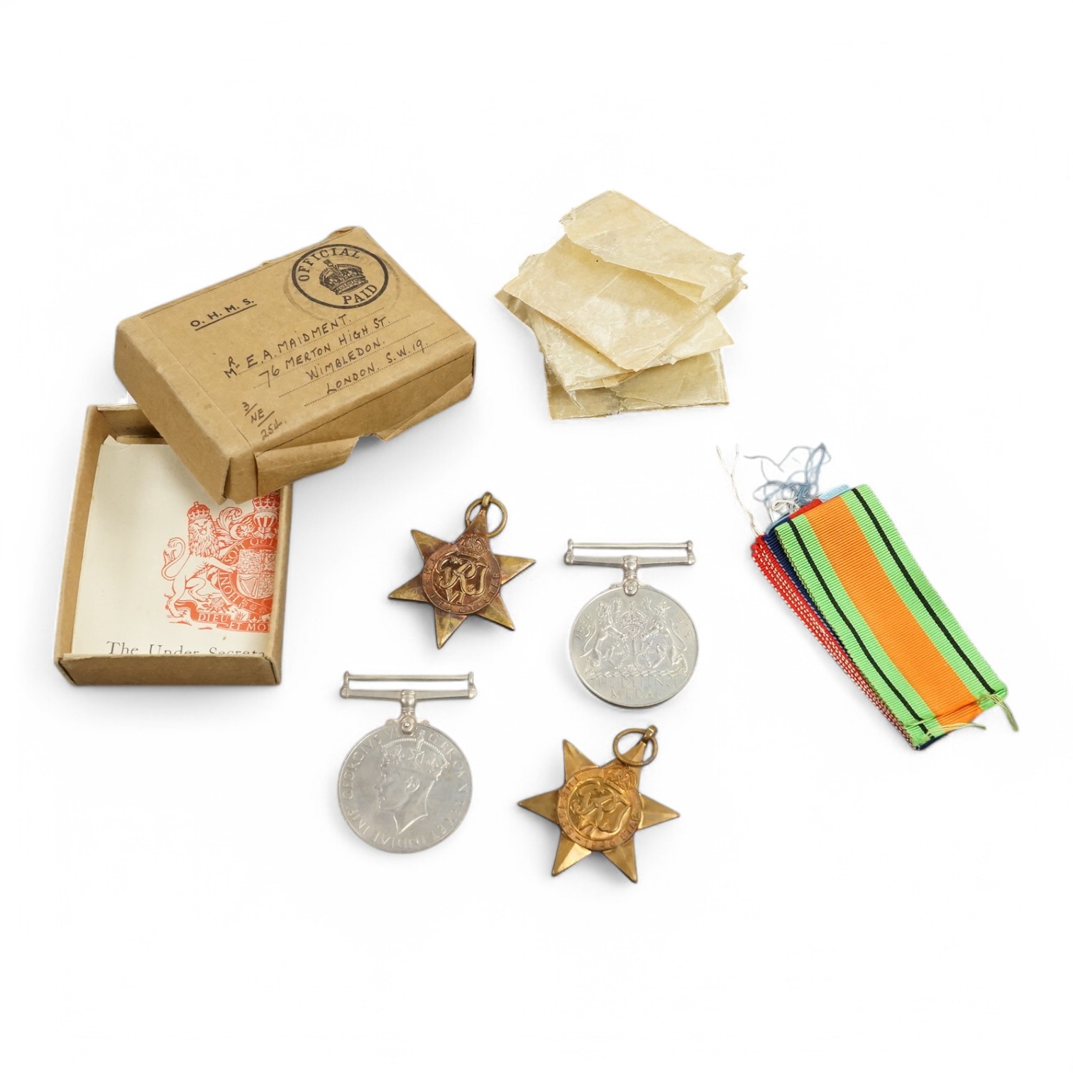 A WWII medal group awarded to E.A. Maidment, comprising; 1939-45 Star, Italy Star, Defence Medal and War Medal, in original card issue box with leaflet. Condition - good, medals still contained within their greaseproof e
